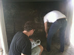 Anthony and Muzam prepping the fireplace so we can load it with logs and glowing pillar candles. Anthony and Muzam prepping the fireplace so we can load it with logs and glowing pillar candles.