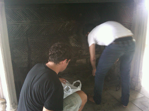 Anthony and Muzam prepping the fireplace so we can load it with logs and glowing pillar candles. Anthony and Muzam prepping the fireplace so we can load it with logs and glowing pillar candles.
