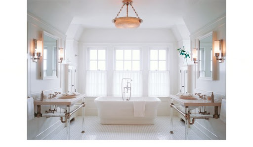 This airy bathroom allows for separate his and hers vanities and a great place to meet in the middle. (mixandchic.com) This airy bathroom allows for separate his and hers vanities and a great place to meet in the middle. (mixandchic.com)