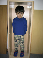 Kai in the kicthen cabinet I had to temporarily take down, to run the new electrical line for the spotlights