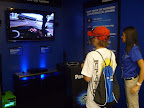 A young man virtually races around the track in 3D.