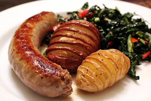 Sicilian Sausage with Hasselbeck Potatoes and Black Kale Salad
