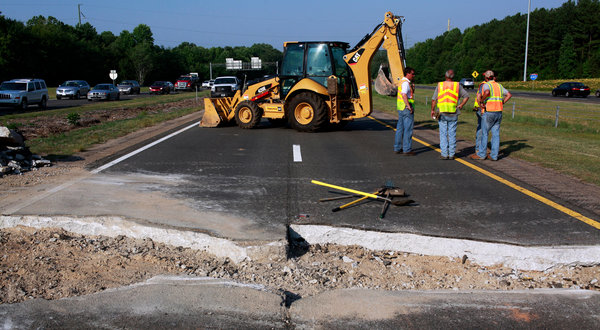 Emergency repairs on a highway that buckled in triple-digit temperatures in June 2012 near Cary, N.C. Travis Long / The News & Observer via Associated Press
