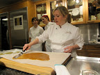 Next, Nancy and her kitchen crew made her chocolate-covered toffee. After the toffee turned a beautiful caramel color, Nancy and her chef assistants pulled it off of the heat and spread it out onto a buttered sheet of parchment paper. Next, Nancy and her kitchen crew made her chocolate-covered toffee. After the toffee turned a beautiful caramel color, Nancy and her chef assistants pulled it off of the heat and spread it out onto a buttered sheet of parchment paper.