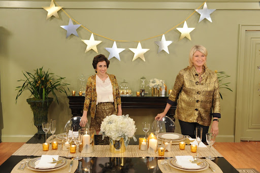 Look at our beautiful table bringing metallic to a new level.
Michael Wainwright “Palio” dinnerware in gold, platinum and rose gold. Martha Stewart Collection with Wedgewood “Bracelet” Stemware Collection, Gold foil from Stumps Spirit. Glass cylinders with foil, go to Martha Stewart Weddings for sources. Cylinders and votives from Jamali Floral & Garden Supplies. Big Glitter Rectangle Placemats from Kim Seybert. Runner (will be available in October) by David Stark for West Elm. Victoria Ghost chairs from Taylor Creative. Flower arrangements by Matthew Robbins Design.