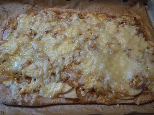 Go ahead, take a slice-Pizza with Caramelized Onions, Apple, and Gruyere cheese.