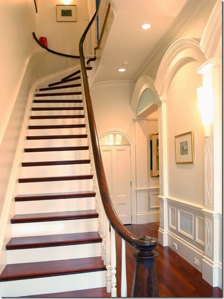 Exciting-Traditional-Staircase-Design-Using-Wooden-Balustrade-and-Wood-Steps-at-Hall-with-Darkwood-Floor-and-Wall-Lamps-South-End