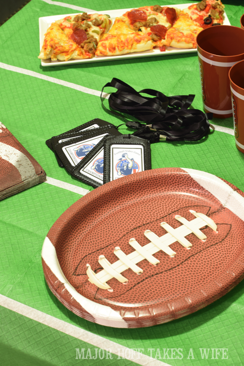 How to set a table for a football party. Looking for a fun party for your teenage boy? Why not throw a Football video game party? Easy ideas for how to entertain kiddos during the Big Game. Features DiGiorno pizza, personalized football cups, free printable lanyards, and an incredible recipe for football shaped ice cream sandwiches! #GameTimeMVP #CollectiveBias #ad How to set a table for a football party. Looking for a fun party for your teenage boy? Why not throw a Football video game party? Easy ideas for how to entertain kiddos during the Big Game. Features DiGiorno pizza, personalized football cups, free printable lanyards, and an incredible recipe for football shaped ice cream sandwiches! #GameTimeMVP #CollectiveBias #ad