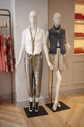 Chic mannequins dressed in sequin pants and a stain bubble skirt with denim vest. And don't you just love the accessories?