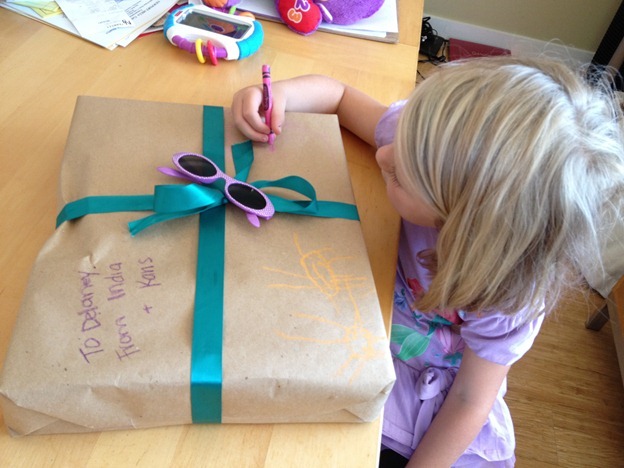 recycle brown bags as wrapping paper that kids can decorate themselves