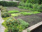 Just behind the house is a vegetable garden.