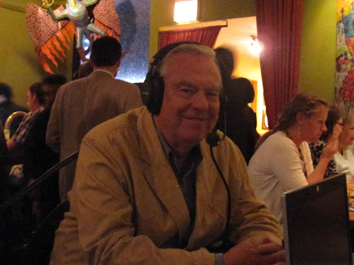 Bill Kurtis enjoys the conversation.