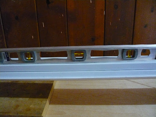 If you have a flat floor, use a level to ensure fixtures are straight and evenly hung.
