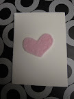 Sweet Maura Madden, of crafternoon.com, handmade these lovely little Valentines from recycled cardstock she had lying around and felt hearts, which she hand-stitched.
