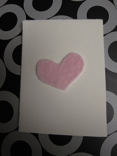 Sweet Maura Madden, of crafternoon.com, handmade these lovely little Valentines from recycled cardstock she had lying around and felt hearts, which she hand-stitched.