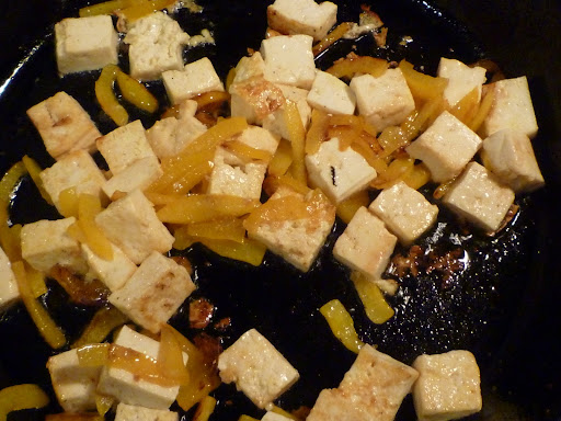 Tofu and yellow bell peppers sauteed until the peppers are tender and the tofu is lightly browned in spots.