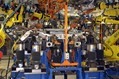 General Motors explained the use of C-Flex technology at its Lansing Grand River Assembly plant Friday, Dec. 13, 2002. C-Flex and other technologies are allowing GM to reduce assembly size by 50,000 to 150,000 square feet and will allow GM to save up to $100 million each time it renovates a plant body shop. GM's C-Flex technology allows for various sheet metal parts to be welded from the same set of tools and robots. The C-Flex units are the cylindrical units visible at the bottom lower left and lower right of the picture. General Motors explained the use of C-Flex technology at its Lansing Grand River Assembly plant Friday, Dec. 13, 2002. C-Flex and other technologies are allowing GM to reduce assembly size by 50,000 to 150,000 square feet and will allow GM to save up to $100 million each time it renovates a plant body shop. GM's C-Flex technology allows for various sheet metal parts to be welded from the same set of tools and robots. The C-Flex units are the cylindrical units visible at the bottom lower left and lower right of the picture.