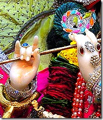 Krishna holding His flute