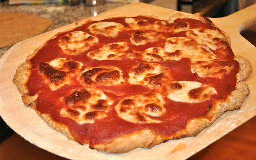 The result:  A perfectly cooked pizza!  Betsy says the dough makes a great grilled bread too.

Photo by:  Samantha Kuvin