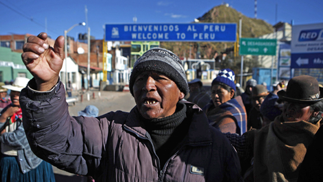 Demonstrators shout slogans in Desaguadero, Peru, on Wednesday, May 18, during two weeks of protests against Vancouver-based Bear Creek Mining's proposed silver mine. Juan Karita / Associated Press