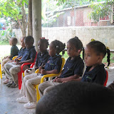 Ayline, Blaini, Maria and Chinaida are enthralled by the story.  (From front to back)