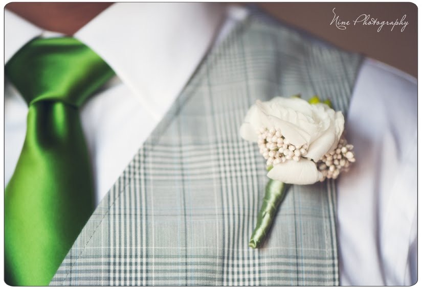 [groom-ranunculus-bows-and-arrows4.jpg]