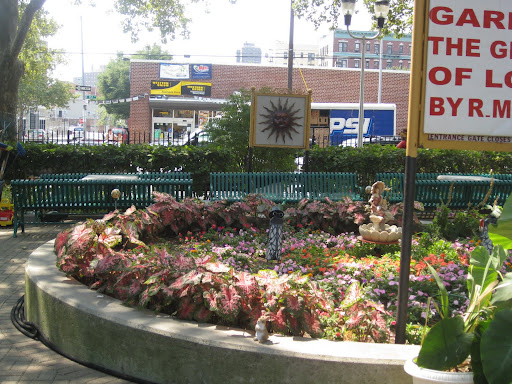 Shady benches and colorful plantings welcome visitors to stay awhile.