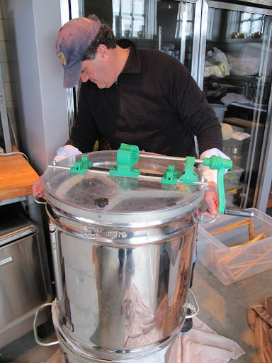 So, Carlos, you've uncapped the frames with your special tool and loaded them into the extractor.  When it spins, the centrifugal force will make the honey flow out of the comb.