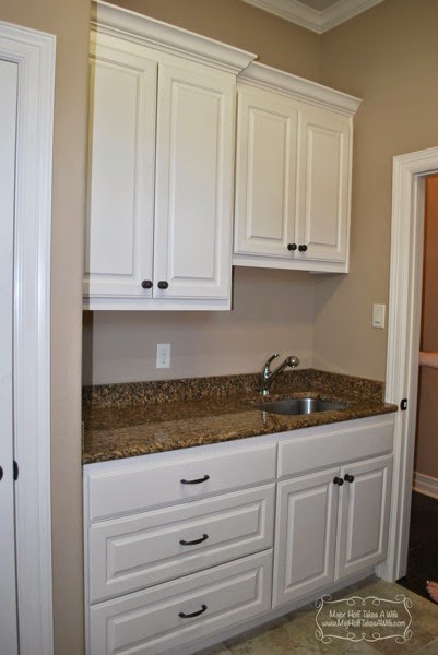 white laundry room with drawers.jpg White laundry room with drawers