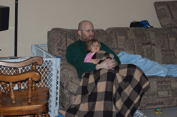 Snuggled up with daddy under a blanket... (that doesn't happen very often)