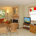 The Madison Townhouse (East) features a spacious and comfortable living room with a fireplace.
