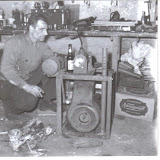 My grandfather Steven Toppa - as always with a cigarette, a Narragansett beer, and a machine