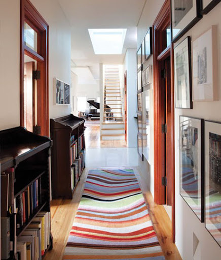 Use a colorful rug to greet your guests. (apartmenttherapy.com) Use a colorful rug to greet your guests. (apartmenttherapy.com)