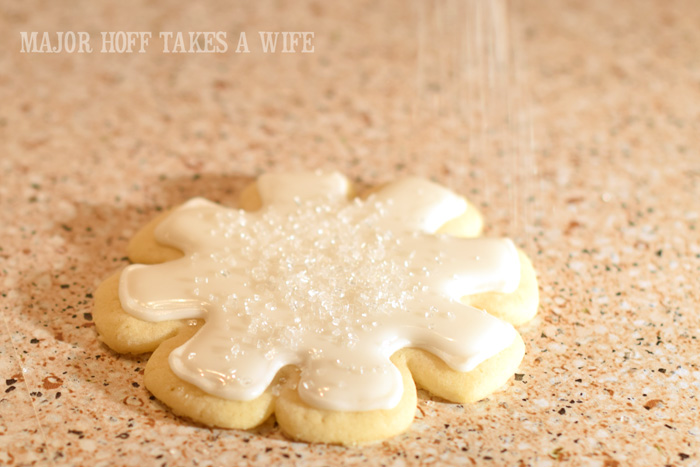 Sugar crystals falling on a cookie. Christmas Snowflake Sugar Cookies : How to make icing and decorate. A wonderful step by step tutorial on how to make icing. You won't believe how easy it is to make! One of your favorite Christmas Cookie recipes will look stunning and elegant and truly worthy of gift giving! Because who doesn't love sugar cookies? Part of the Holidays Made Easy blog series. #HolidaysMadeEasy Sugar crystals falling on a cookie. Christmas Snowflake Sugar Cookies : How to make icing and decorate. A wonderful step by step tutorial on how to make icing. You won't believe how easy it is to make! One of your favorite Christmas Cookie recipes will look stunning and elegant and truly worthy of gift giving! Because who doesn't love sugar cookies? Part of the Holidays Made Easy blog series. #HolidaysMadeEasy