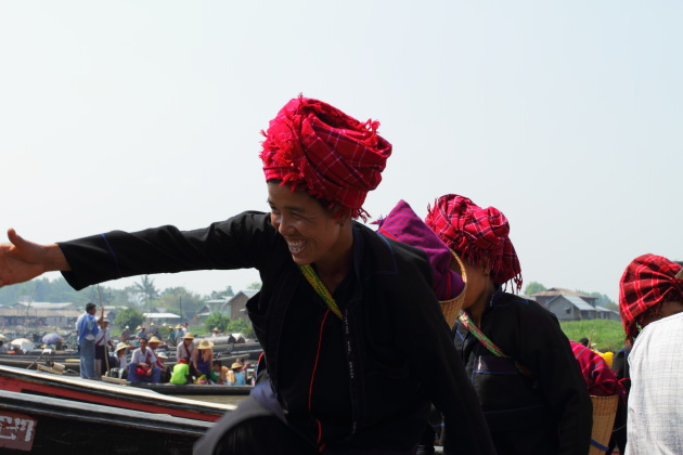 Inle Tribal Woman smiles as she gets off the boat