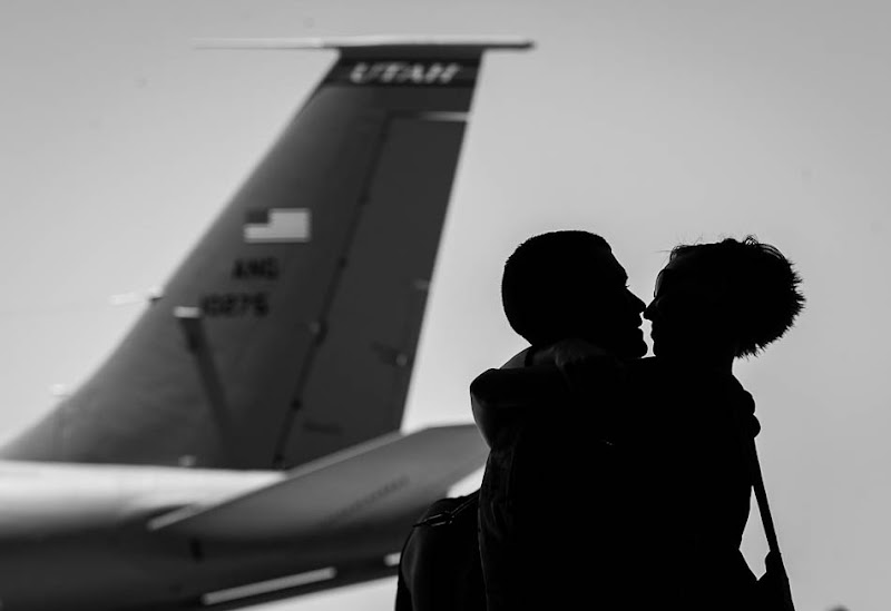 Mickaela Hawkley embraces her husband Bleu as the soldiers from the Utah Army National Guard's Second Battalion, 211th Aviation unit returned from a 12-month deployment to Afghanistan, Saturday, June 23, 2012 in Salt Lake City, Utah.