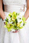 Cymbidium orchids, star of Bethlehem, lady's mantle, and seeded eucalyptus create a soft yet textural bouquet.
Photo by Milton Morris. Cymbidium orchids, star of Bethlehem, lady's mantle, and seeded eucalyptus create a soft yet textural bouquet.
Photo by Milton Morris.