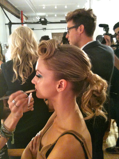 The curls of the ponytail are pinned in place (so they don't loosen up before the show), but, here, you can see the silhouette Tommy was going for: A twirled lock in front, volume at the crown, and a bouncy, pony finish. The curls of the ponytail are pinned in place (so they don't loosen up before the show), but, here, you can see the silhouette Tommy was going for: A twirled lock in front, volume at the crown, and a bouncy, pony finish.