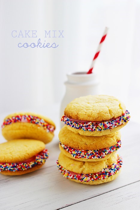 Cake Mix Cookie Sandwiches – A little bit cake, a little bit cookie, alotta delicious! These cookie sandwiches are easy and sprinkle-covered! | thecomfortofcooking.com