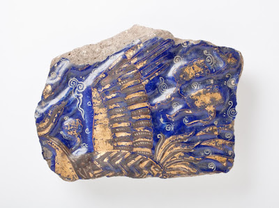 Tile | Origin: Iran | Period: second half of 13th-14th century | Collection: The Madina Collection of Islamic Art, gift of Camilla Chandler Frost (M.2002.1.269) | Type: Ceramic; Architectural element, Fritware, molded, overglaze-painted and leaf-gilded, 7 1/2 x 5 1/2 in. (19.05 x 13.97 cm)