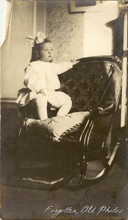 child in chair Pr antiques