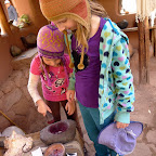 Lily tries her hand at the mortar and pestle.
