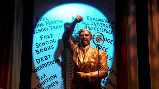 Land of Senator 'Share our Wealth' Huey Long. (notice the arms)