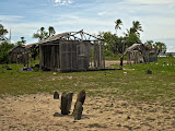 The sacred stones in the foreground, with the king's dilapidated "heritage" house behind it. Madagascar6 - 077.jpg