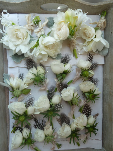 Here you can see all the boutonnieres, which were created by Heather at Gathering Events. Loved the feather accents!