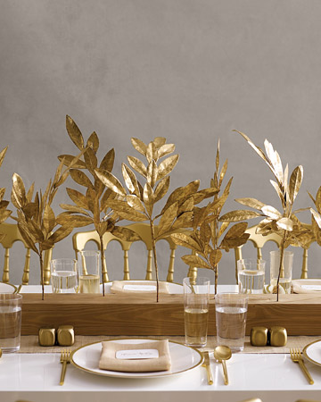 Juxtapose opulent gold branches (in the form of faux bay-laurel twigs) with the humble grace of wood. (marthastewartweddings.com) Juxtapose opulent gold branches (in the form of faux bay-laurel twigs) with the humble grace of wood. (marthastewartweddings.com)