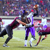 UNI quarterback, Tirrell Rennie, gets hit by Grizzliesâ defensive tackle Bryan Walkhauser.