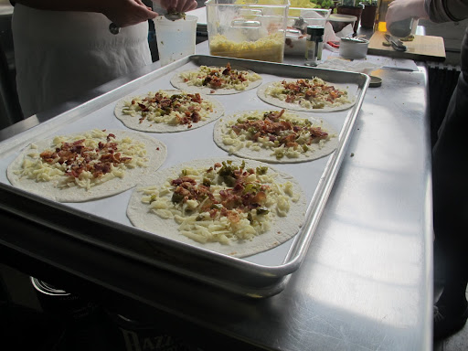 The quesadilla assembly line begins
