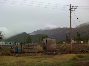 Clouds peaking over the mountains in my village.