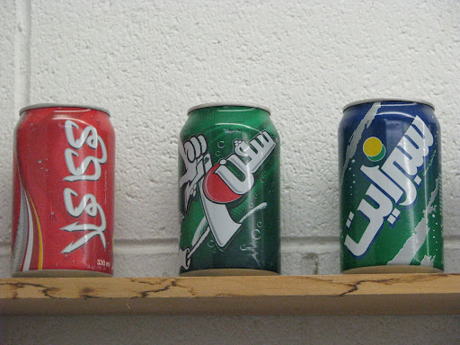 Cans of soda bearing Arabic script are displayed in Salem's store. (Photo credit: Jennifer Moore)